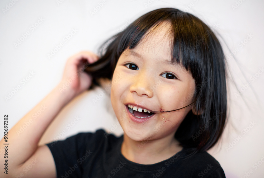Close up portrait of little asian girl just finished eating Close up portrait of little asian girl just finished eating