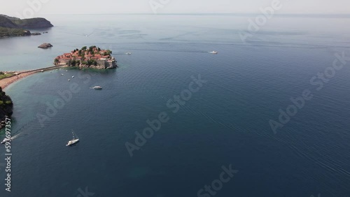 Aerial video of Sveti Stefan Montenegro Old city beach. Beautiful place, old island, Montenegro  tourism.