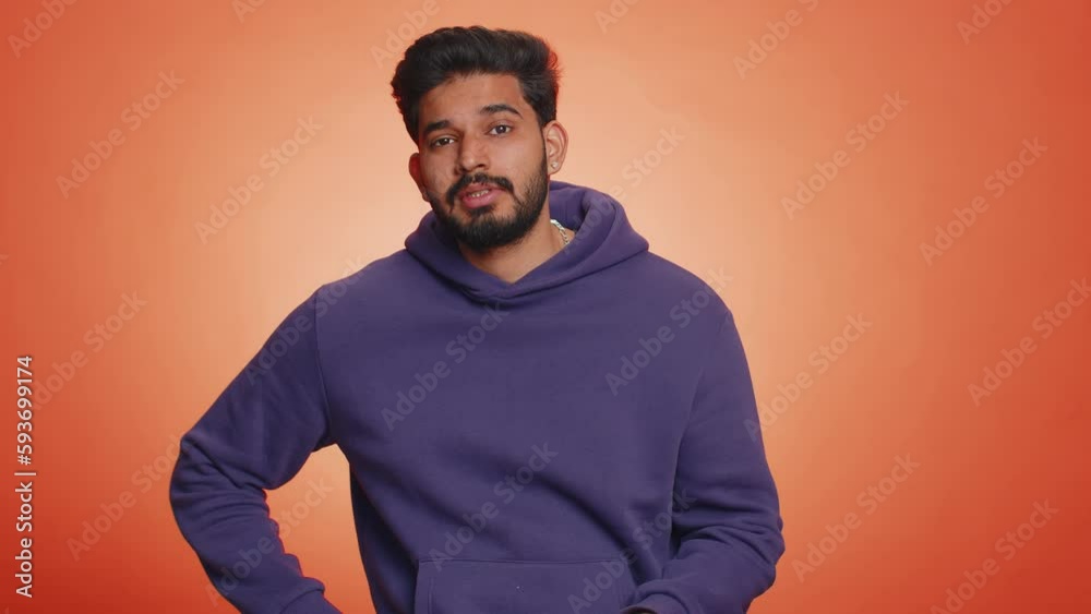 Face palm. Shame on you. Upset surprised young indian man making face palm gesture, loses, feeling bored, disappointed in result, bad news. Handsome hindu guy isolated on orange background, indoors