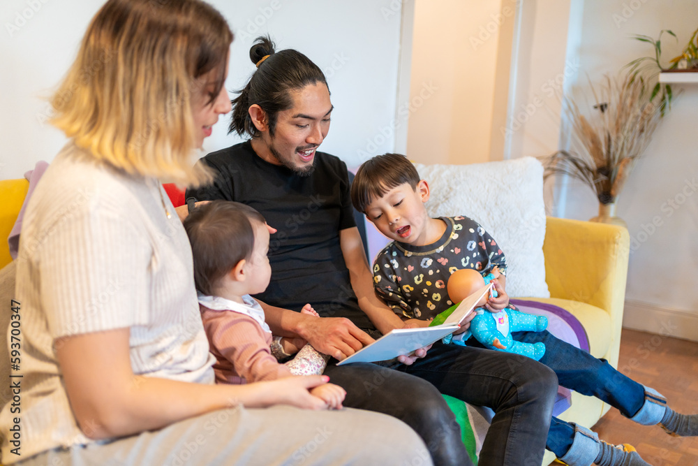 Parents Reading A Storybook To His Children Parents Reading A Storybook To His Children