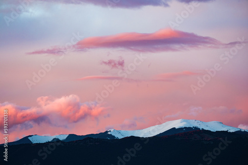 Stunning view of snowcapped mountains during a beautiful sunset.