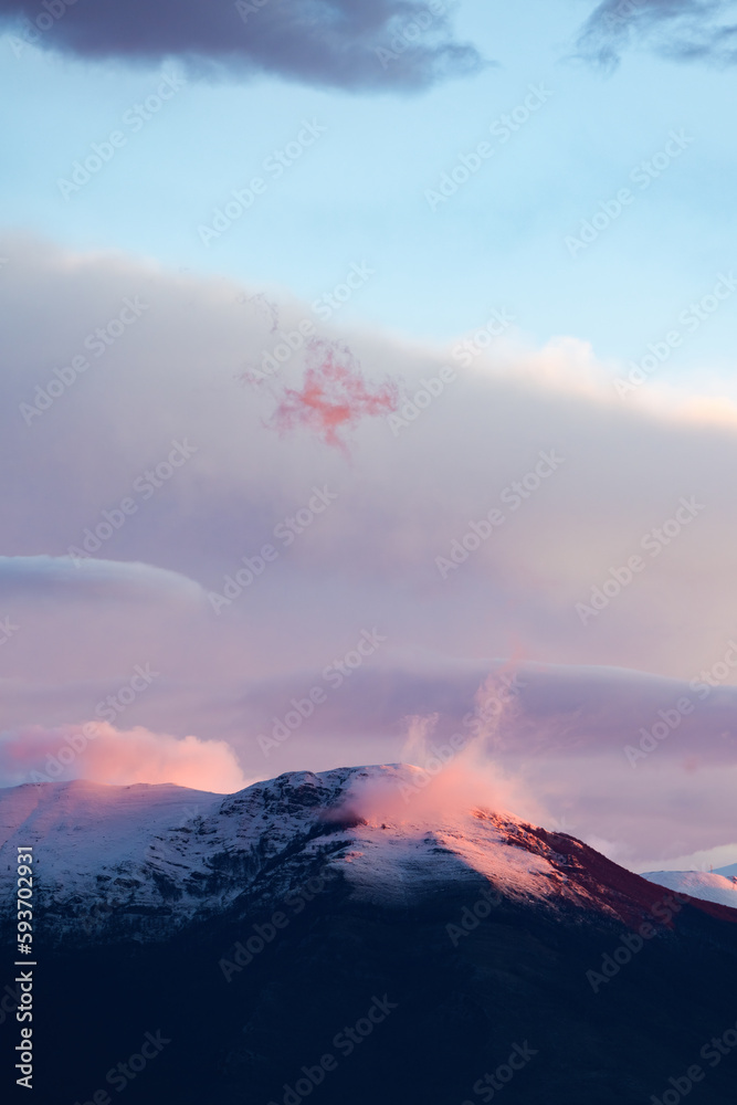Stunning view of snowcapped mountains during a beautiful sunset.