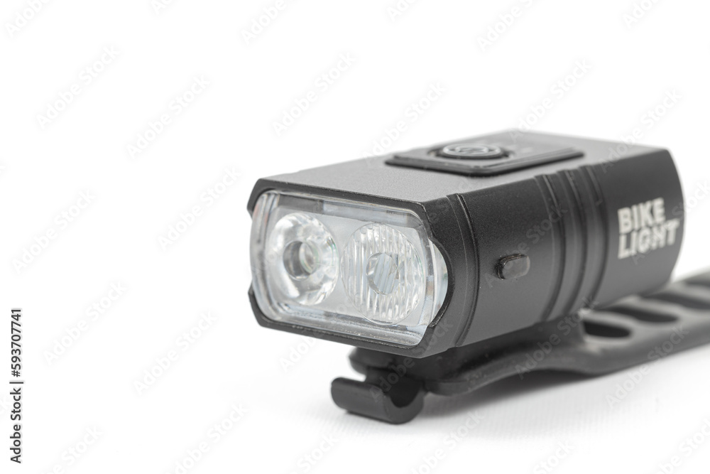 LED bicycle white front light isolated above white background with copy space LED bicycle white front light isolated above white background with copy space