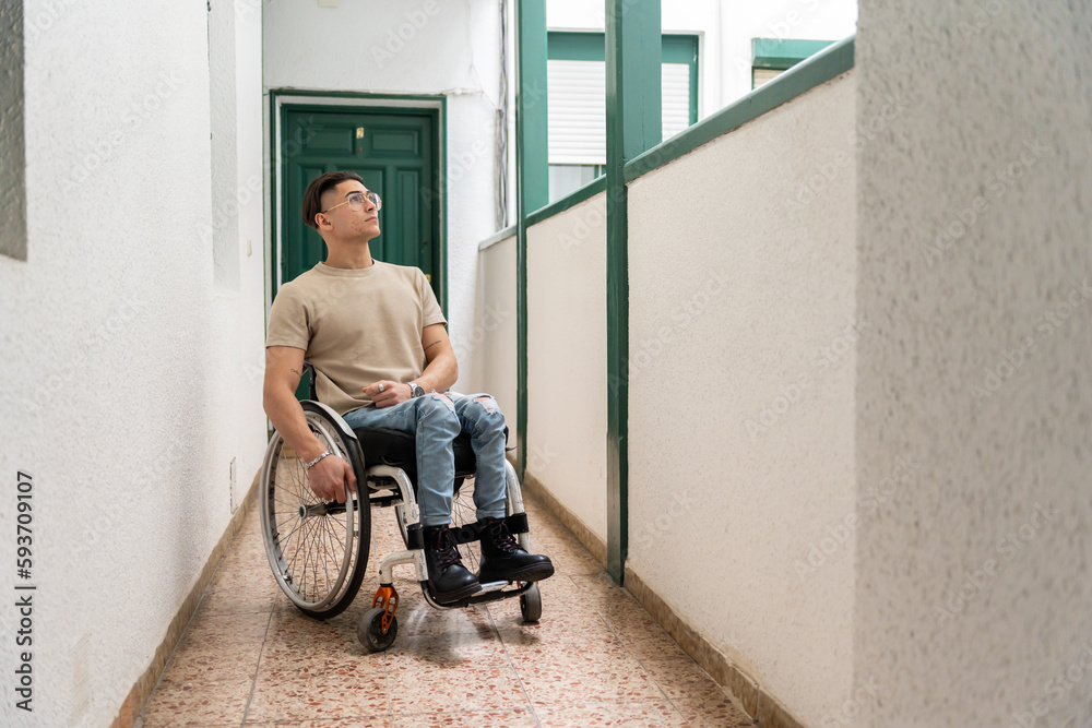 Wheelchair User Goes Through A Hall Of A Building Wheelchair User Goes Through A Hall Of A Building