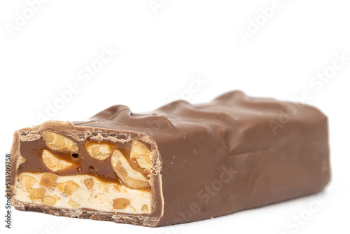 Chocolate bar with peanuts isolated above white background