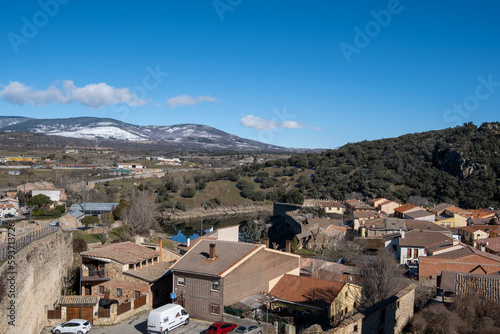 Pueblo madrileño de Buitrago de Lozoya visto desde el muro con las montañas nevadas al fondo. photo