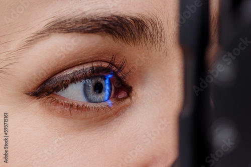 Woman under eye scanning in clinic photo