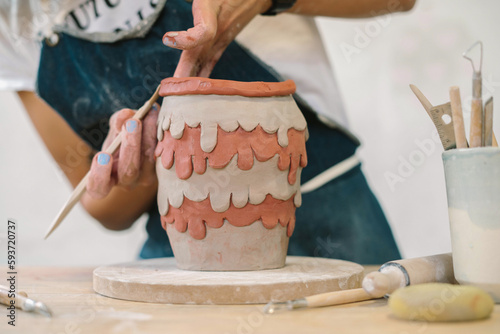  Modeling of a creative and youthful ceramic piece of pottery photo