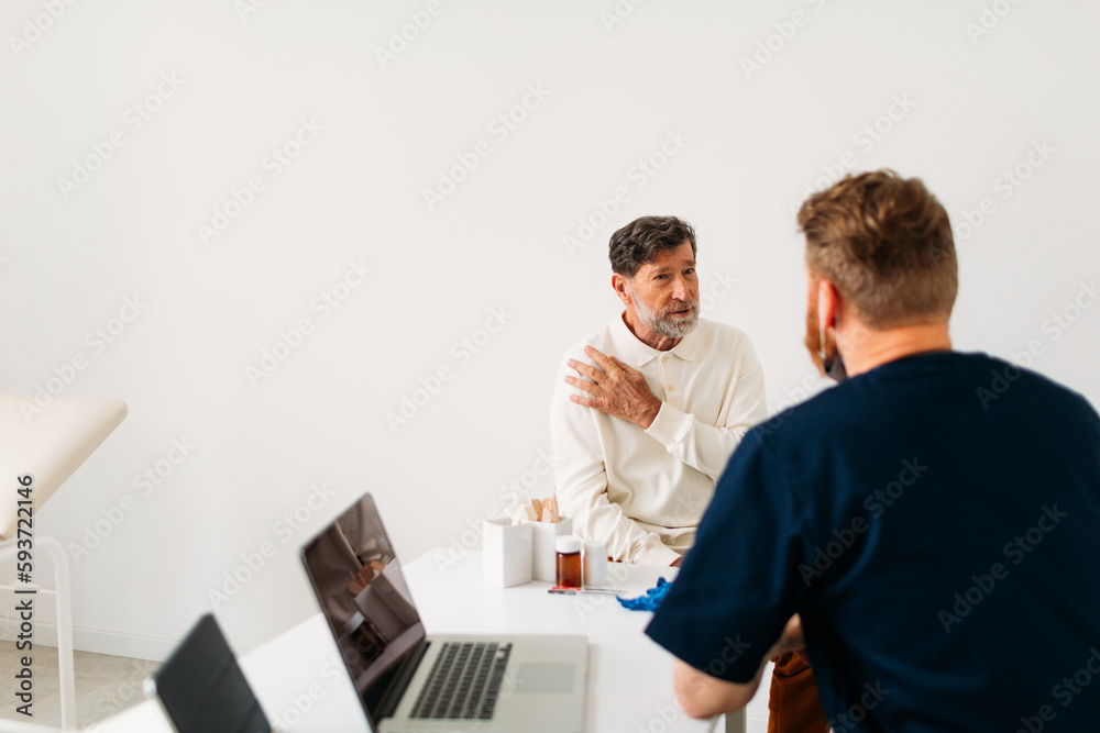 Doctor Examining Young Man Doctor Examining Young Man