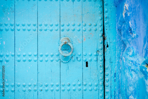 Blue painted door in a blue building photo