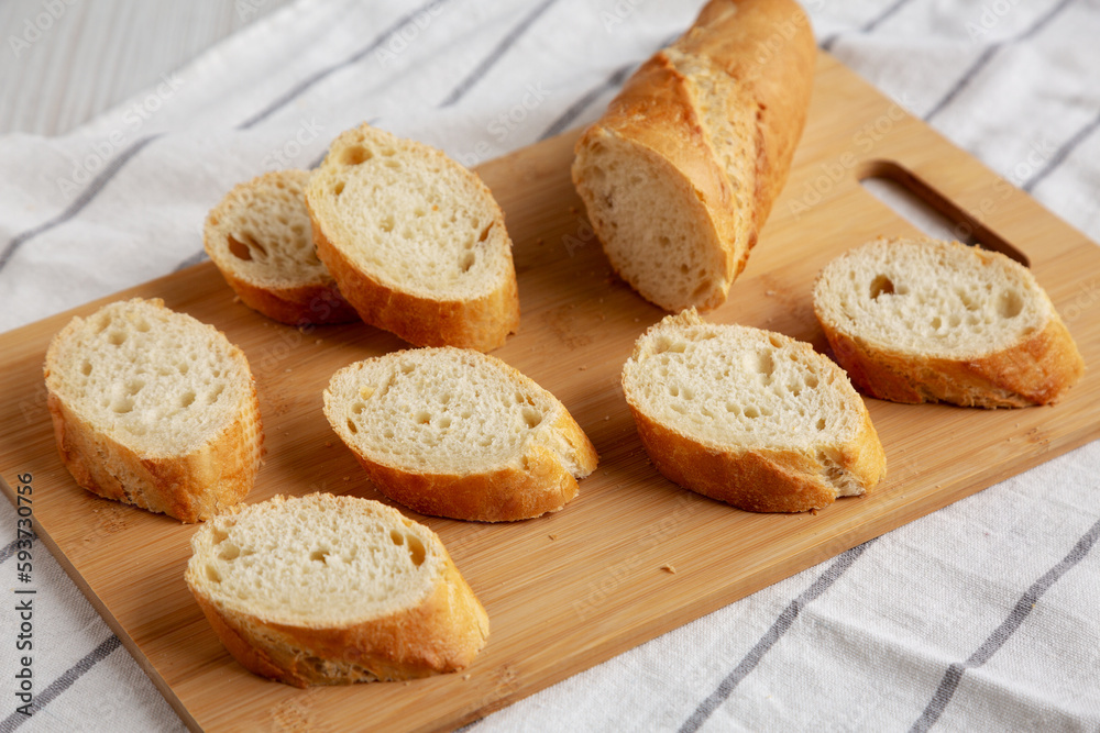 Homemade Sliced Bread on a bamboo board, low angle view. Close-up. Homemade Sliced Bread on a bamboo board, low angle view. Close-up.