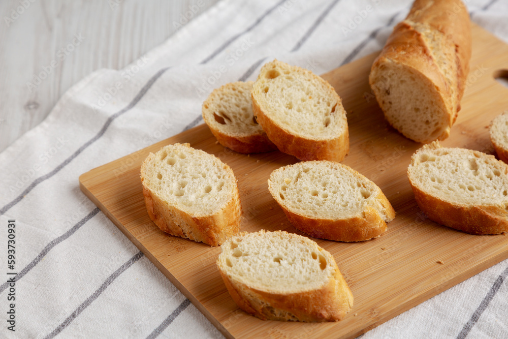 Homemade Sliced Bread on a bamboo board, low angle view. Homemade Sliced Bread on a bamboo board, low angle view.