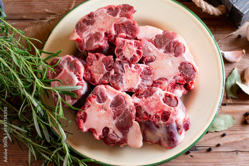 Raw beef Oxtail cut Meat on cutting board. Top view. Raw beef Oxtail cut Meat on cutting board. Top view.