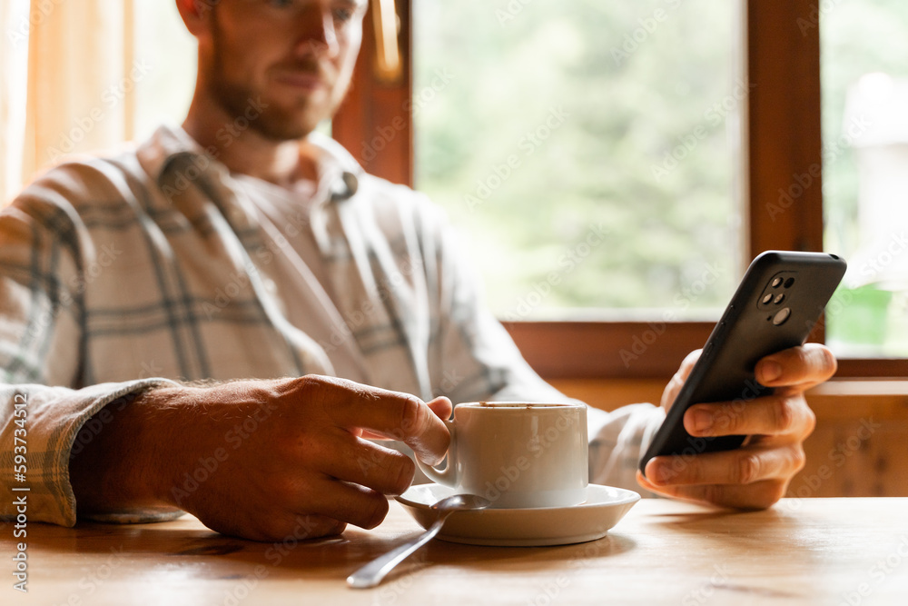 Man drinking coffee cup checking phone Man drinking coffee cup checking phone
