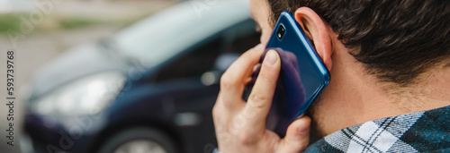man using smartphone in car background