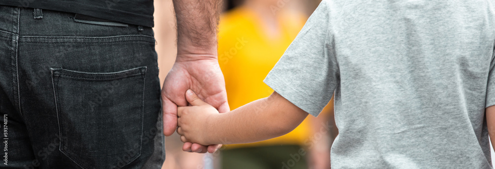 A man and a child are walking