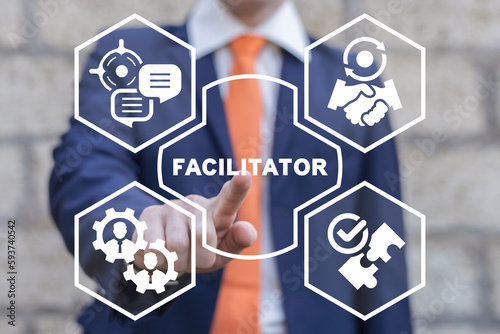 Facilitator using virtual touch screen presses text button: FACILITATOR. Business concept of facilitator. Facilitation service.