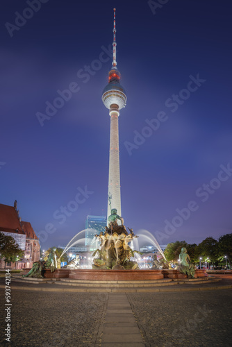 TV Tower (Fernsehturm) at night and Neptune Fountain - Berlin, Germany photo