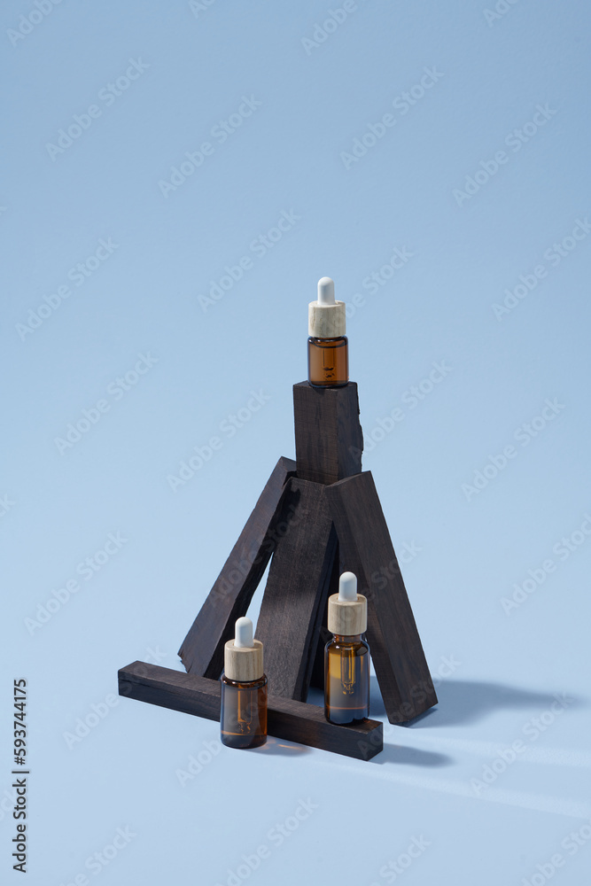 Amber glass bottle on wooden podium Amber glass bottle on wooden podium