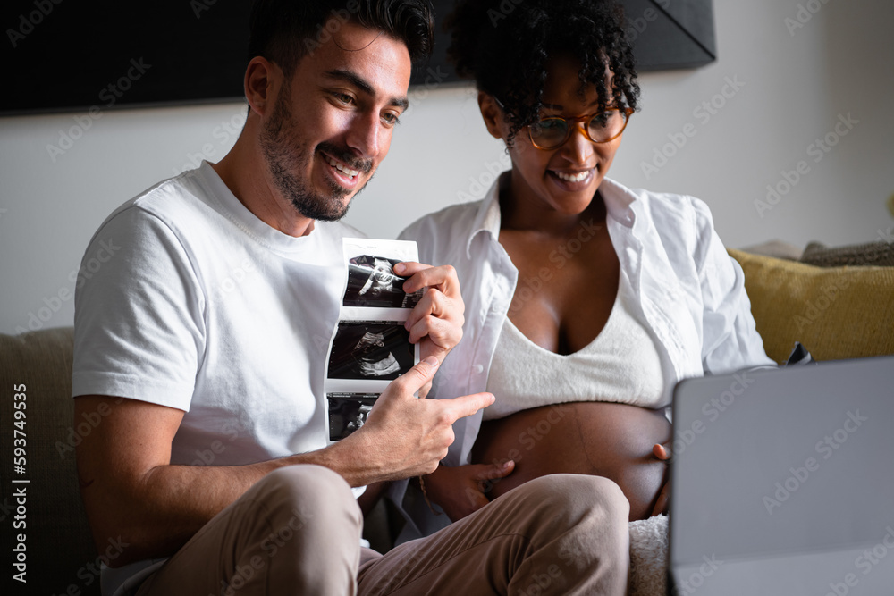 Happy pregnant couple showing ultrasound result Happy pregnant couple showing ultrasound result