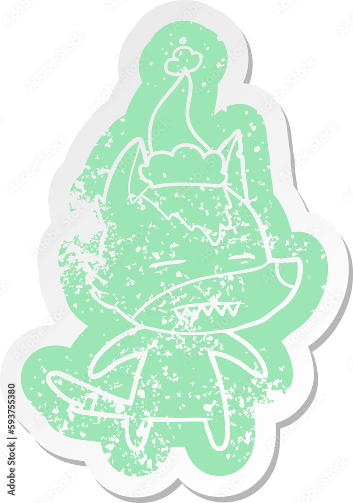 Obraz premium cartoon distressed sticker of a wolf showing teeth wearing santa hat