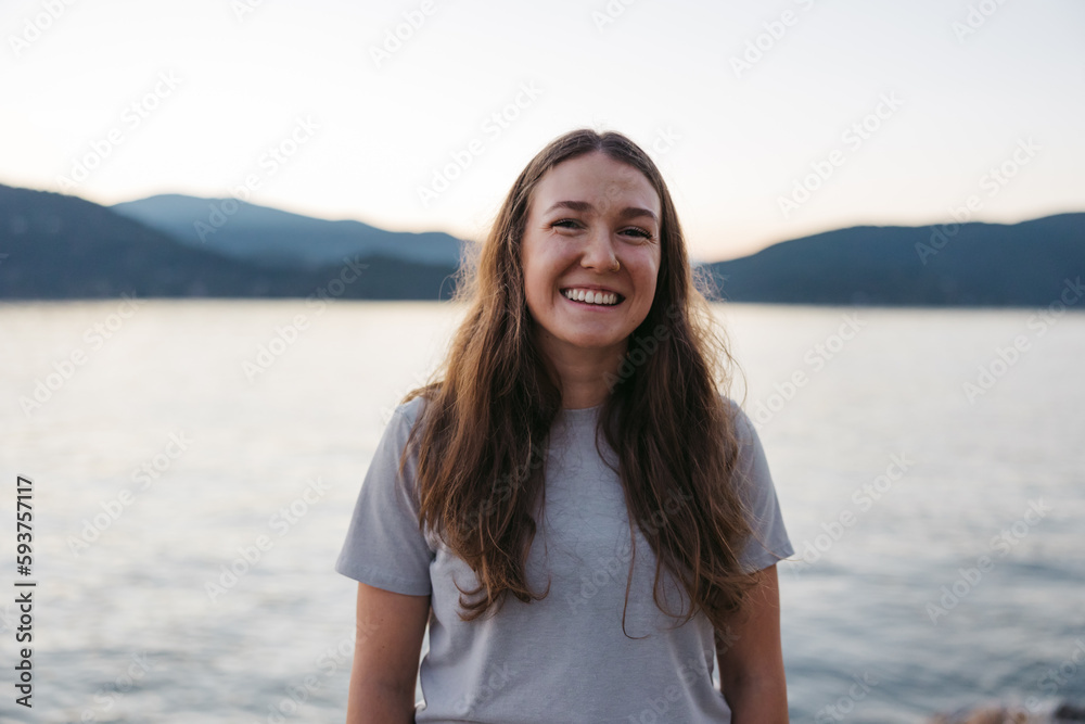 Smiling, happy young woman near the ocean water. Smiling, happy young woman near the ocean water.