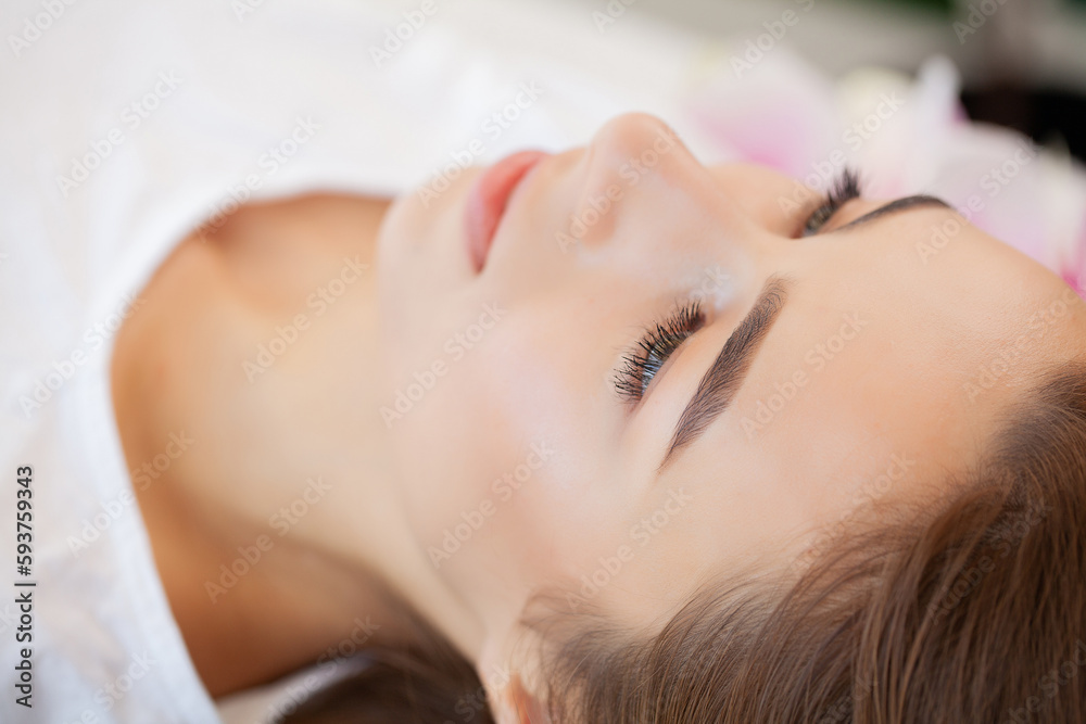 Young woman getting spa massage treatment at beauty spa salon Young woman getting spa massage treatment at beauty spa salon