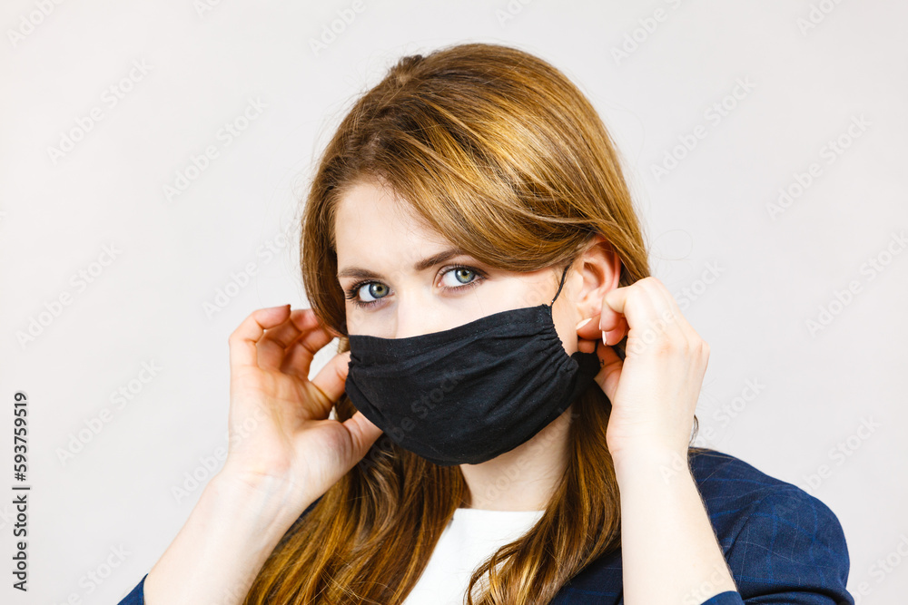 Female using protective face mask. Female using protective face mask.