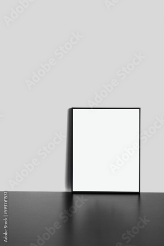 Blank Frame Mockup on black wooden table