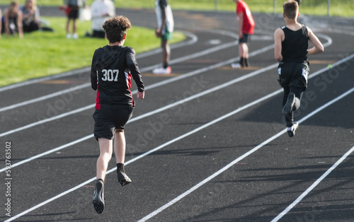 Highschool boy running track
