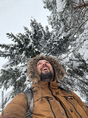 Man on winter first snow photo