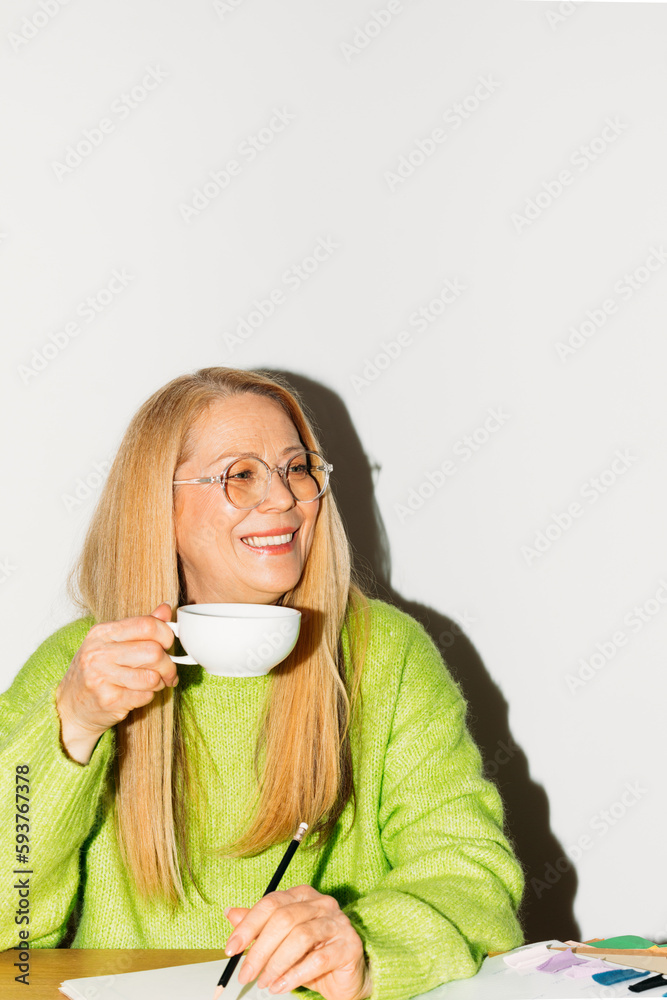 Woman Drinking Coffee and Writing Notes Woman Drinking Coffee and Writing Notes