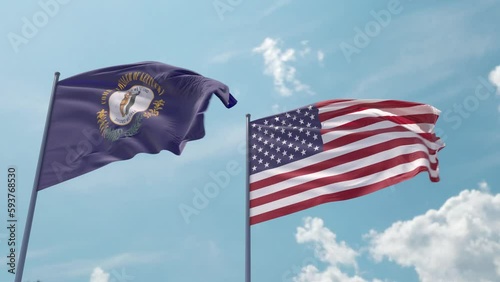 Kentucky and the USA on a flagpole realistic wave on strong wind in blue sky. Commonwealth of Kentucky and The United States of America