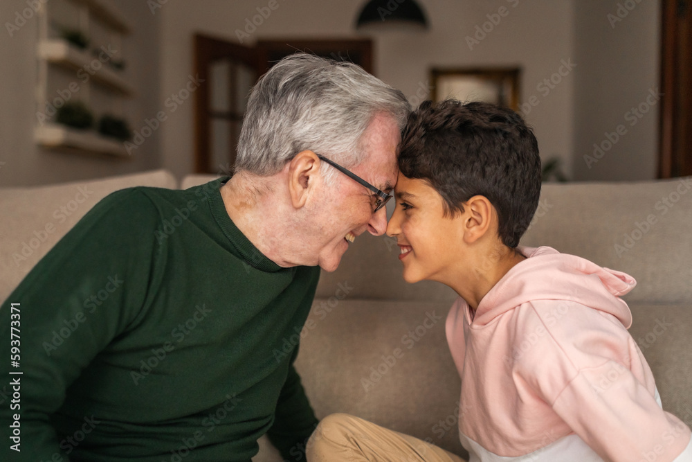 grandfather playing with his grandson at home grandfather playing with his grandson at home