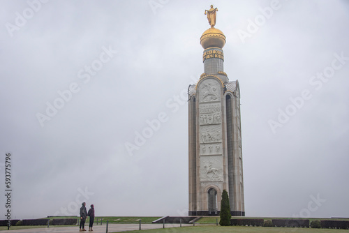 It is a belfry memorial to the great battle. There are two people on the frontground. photo