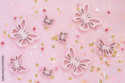 butterflies and confetti on pink background monochromeon.