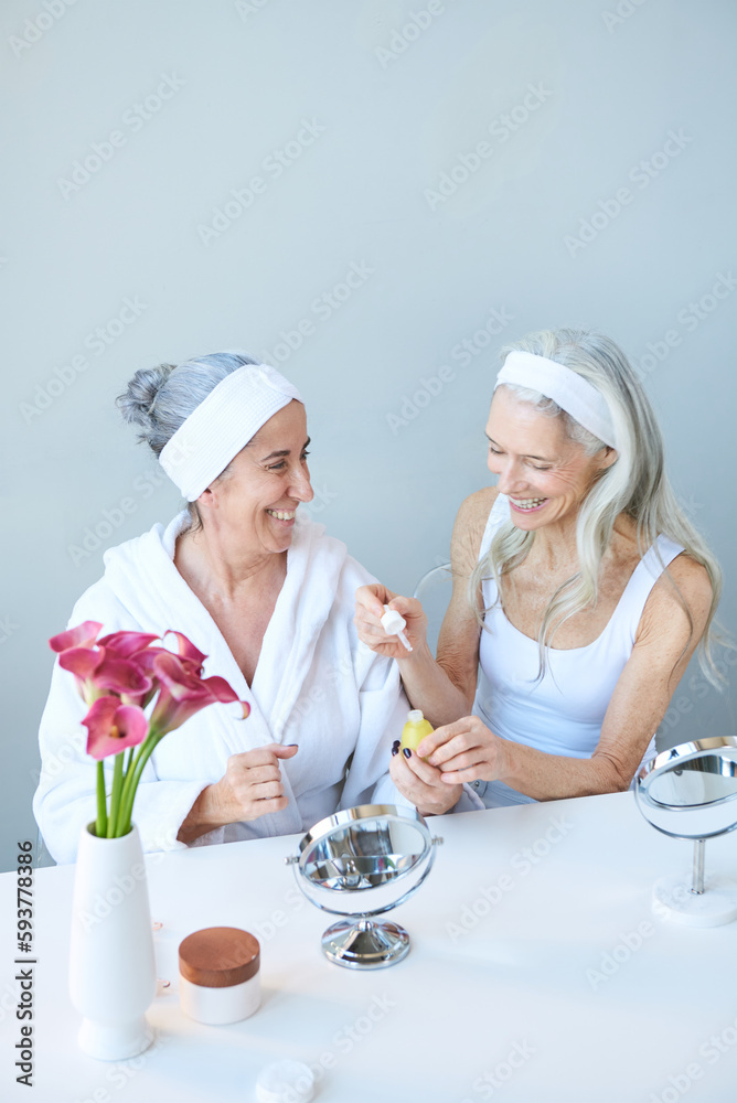 Friends applying creams and make up Friends applying creams and make up