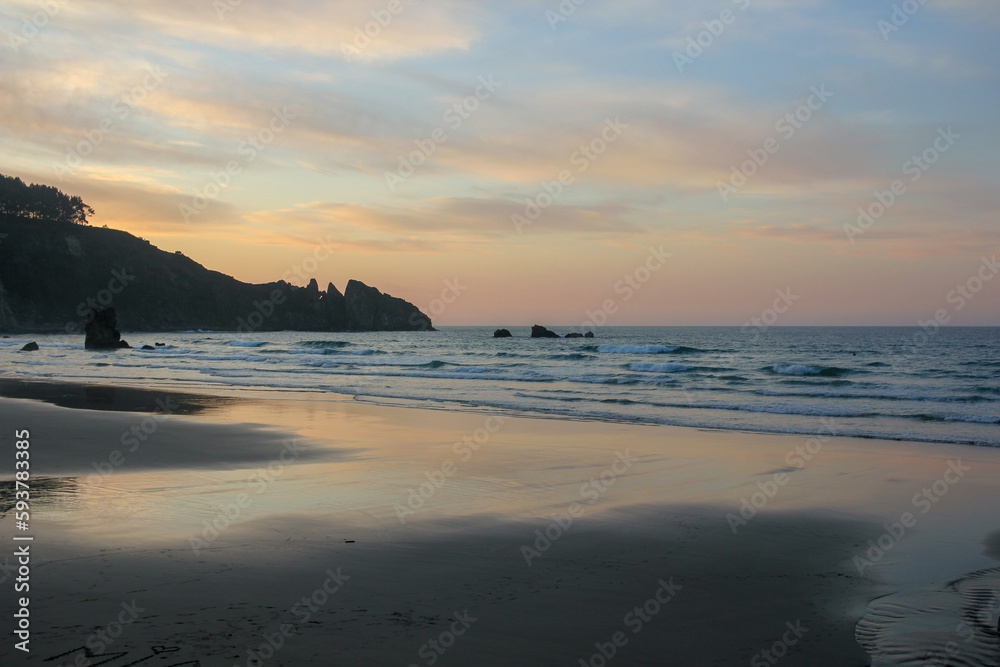 sunset in Aguilar beach in Asturias, Spain
