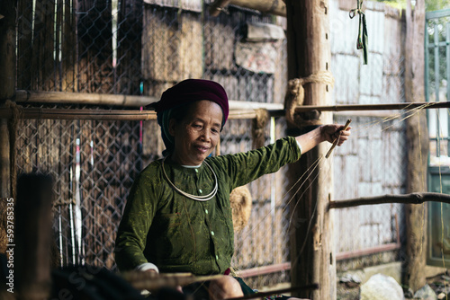 Local people: Hmong weaver working with hemp photo