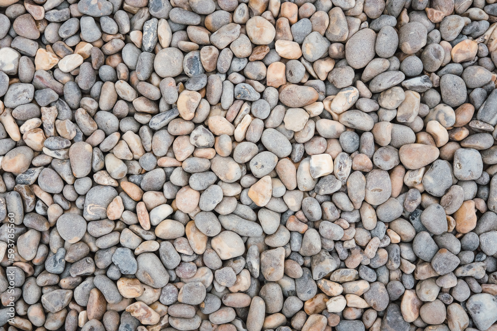 Grey and brown coloured pebbles Grey and brown coloured pebbles