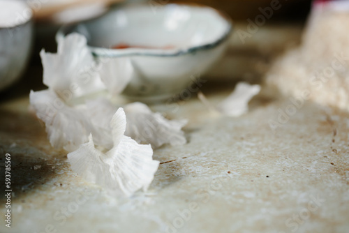 The papery skin of garlic on a table