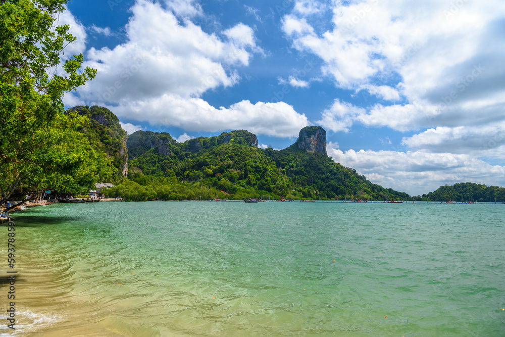 Rocks and cliffs covered with tropical trees, azure water on Ao Phra Nang Beach, Railay east Ao Nang, Krabi, Thailand