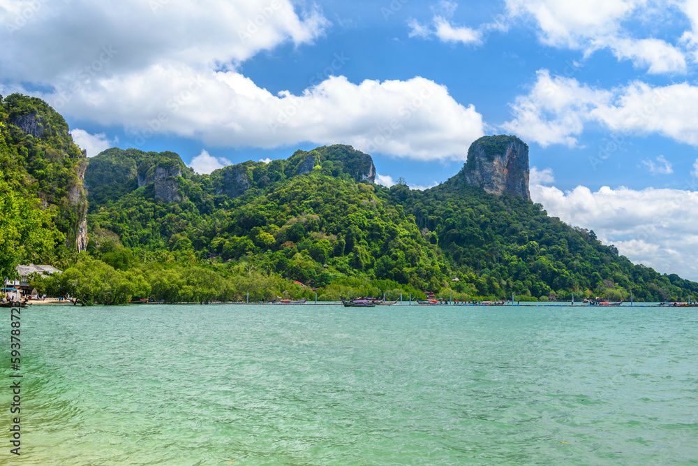 Rocks and cliffs covered with tropical trees, azure water on Ao Phra Nang Beach, Railay east Ao Nang, Krabi, Thailand