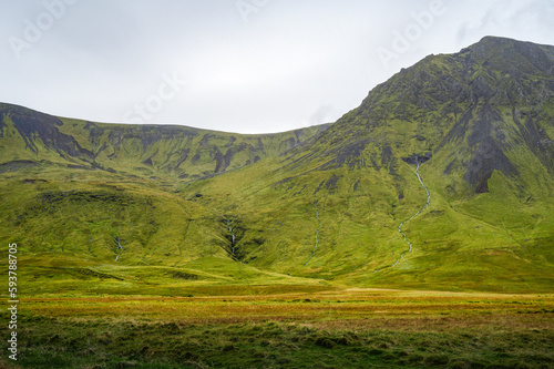 Icelandic landscape, lush green moss and streams running down the mountains, Iceland