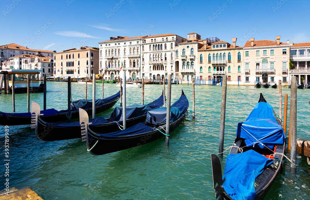 Scenic view of famous Grand canal with ancient buildings and boats in sunny day, Venice, Italy