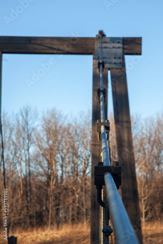 Perspective of a steel and wood suspension bridge