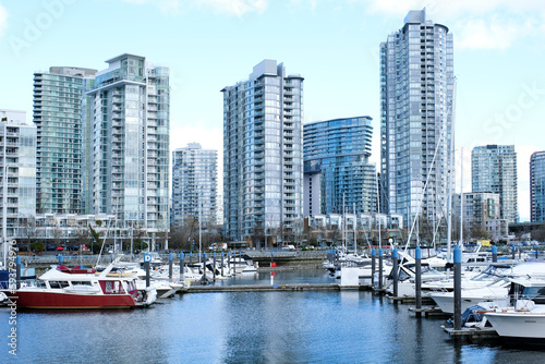 David Lam Park Yaletown spring pacific ocean jetty cyclists sun clear sky blossoming sakura cherry and magnolia trees sunny day seagulls fly rest weekend spend time with family vancouver canada 2023