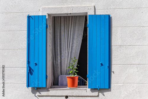 A window in a traditional, Provencal, French home in Marseille, France.