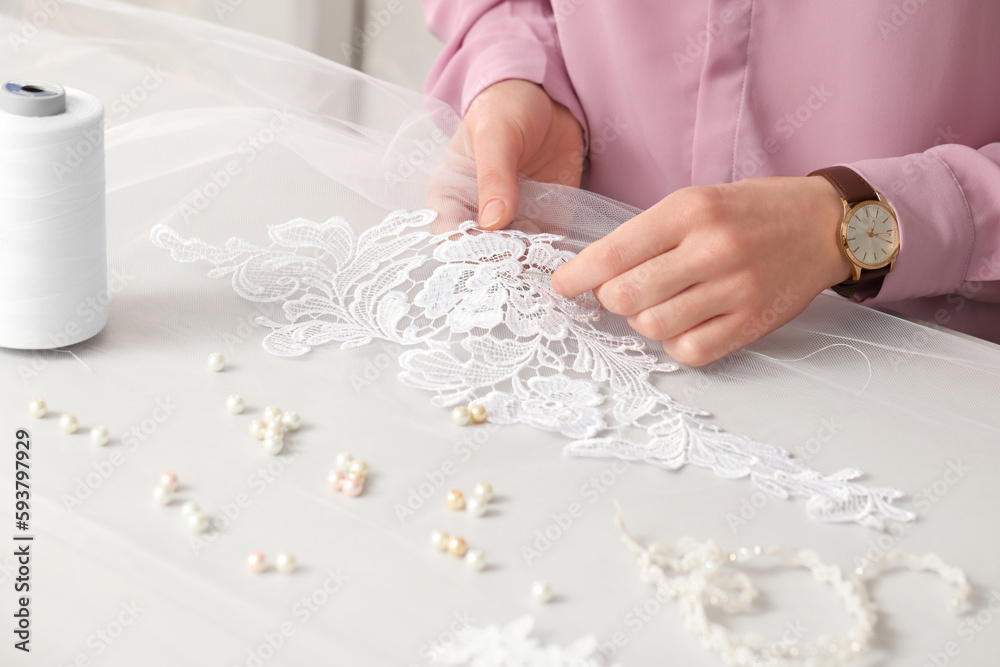 Ταπετσαρία Dressmaker working with beautiful white lace at table in atelier, closeup