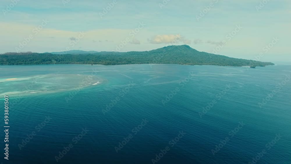 Slow aerial move towards a mountain peak in the distance. Slow aerial move towards a mountain peak in the distance.